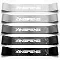 Craft Plus resistance loop exercise bands in various colors, shown coiled on a flat surface for strength training and physical therapy.