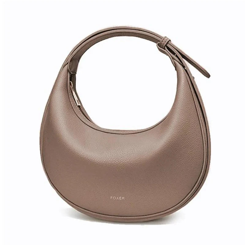 Retro women's crossbody bag by Craft Plus with trendy design, featuring a compact style and stylish strap, showcased in the image.