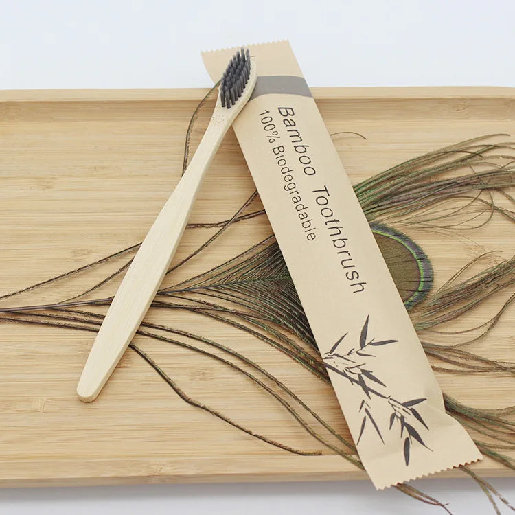 Reusable eco-friendly bamboo toothbrush by Craft Plus with natural bamboo handle and soft bristle head for sustainable oral care.