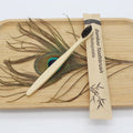 Reusable eco-friendly bamboo toothbrush with natural bamboo handle and soft bristles, ideal for sustainable oral care.