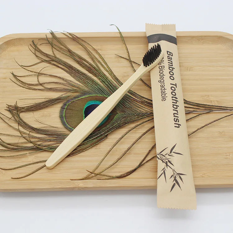 Reusable eco-friendly bamboo toothbrush with natural bamboo handle and soft bristles, ideal for sustainable oral care.
