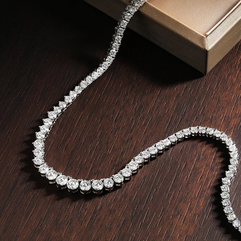 Sterling silver Moissanite tennis necklace with sparkling stones, crafted by Craft Plus, displayed on a neutral background.