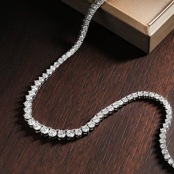 Sterling silver Moissanite tennis necklace with sparkling stones, crafted by Craft Plus, displayed on a neutral background.