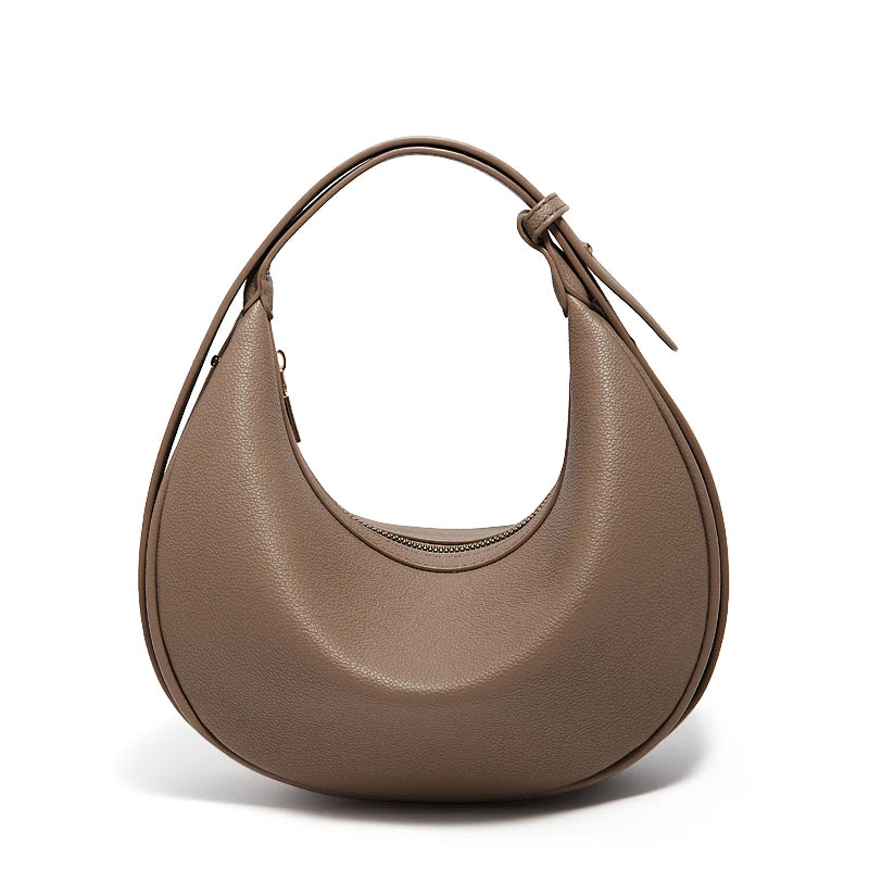 Trendy retro women's crossbody bag by Craft Plus with a compact design, featuring a stylish, vintage-inspired look and adjustable strap.