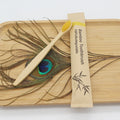 Craft Plus reusable eco-friendly bamboo toothbrush with natural bamboo handle and soft bristles on a white background.
