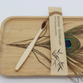 Eco-friendly bamboo toothbrush by Craft Plus with biodegradable handle and soft bristles, shown on a clean white background.