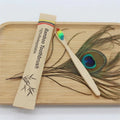 Eco-friendly bamboo toothbrush by Craft Plus with natural bamboo handle and soft bristle head, reusable and sustainable oral care tool.